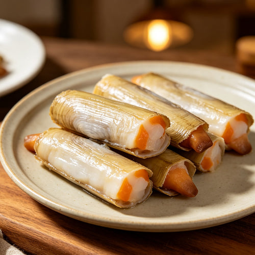 Fresh razor clams on a ceramic plate (1)